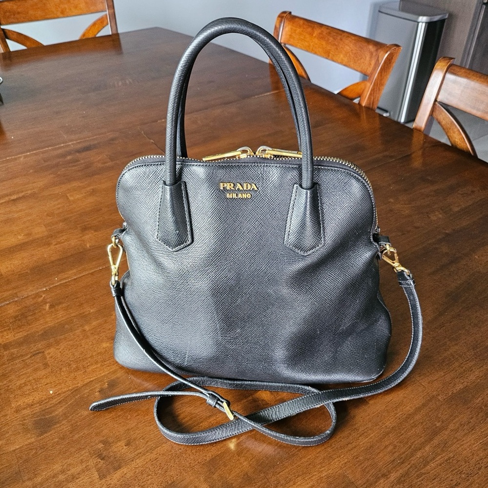 Prada black saffiano leather bag. Top handle with crossbody strap. AUTHENTIC.